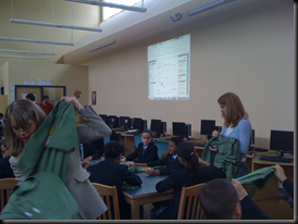 Elise and Jill pass out shirts to an excited crowd of students